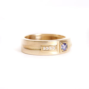 African King Tanzanite with Diamond Highlight Yellow Gold Band