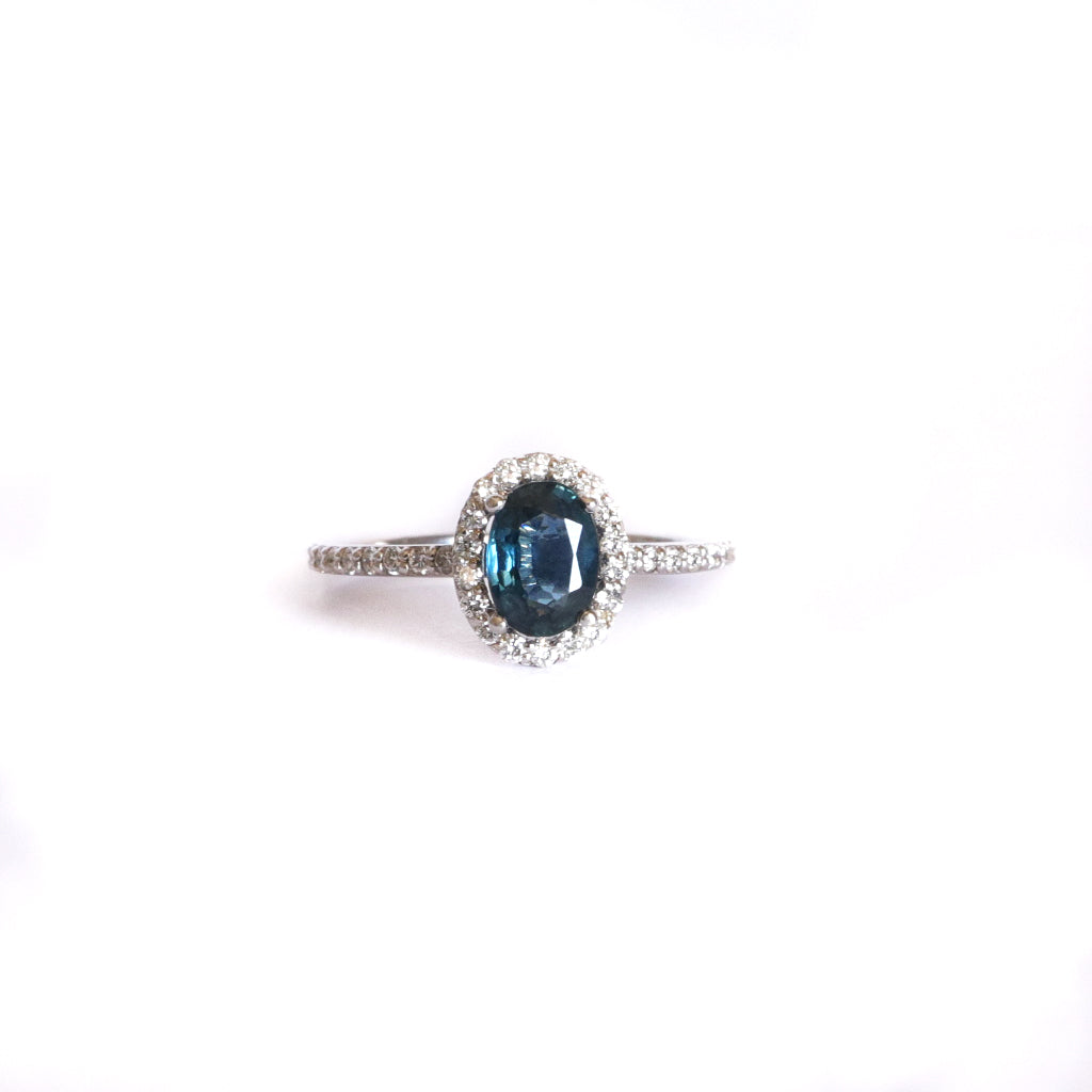 Blue Hued Teal Sapphire and Diamond Halo and Band White Gold Ring Wedding Set