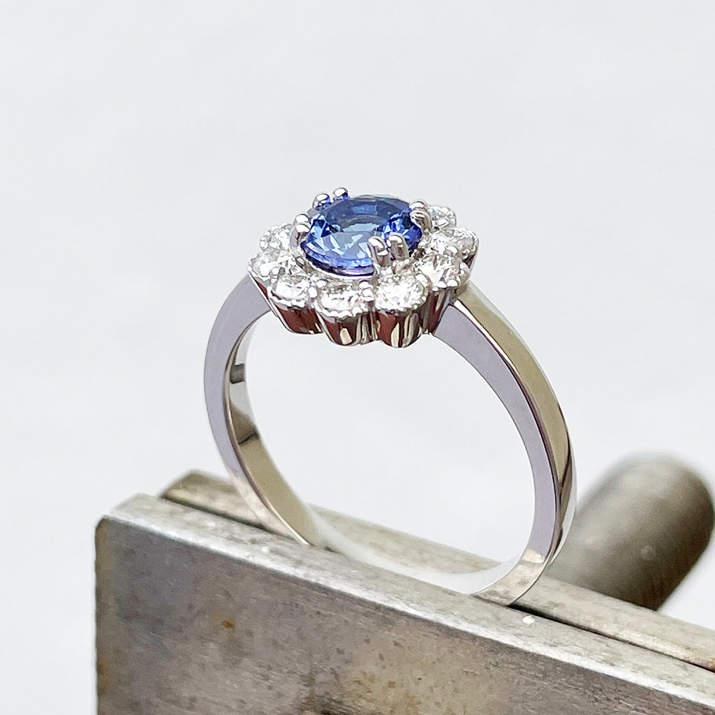 Floral tanzanite and diamond halo ring