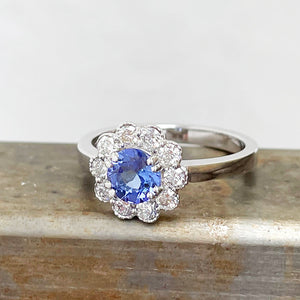 Floral tanzanite and diamond halo ring