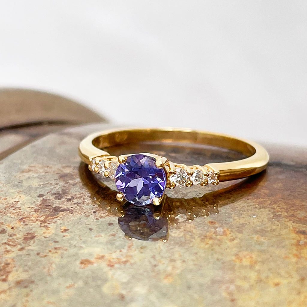 Tanzanite and diamond band engagement ring