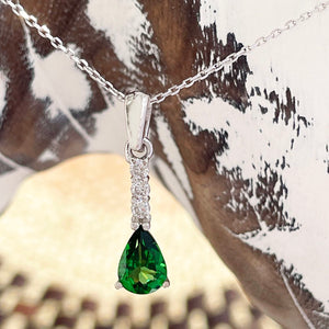 Diamond and tsavorite pendant