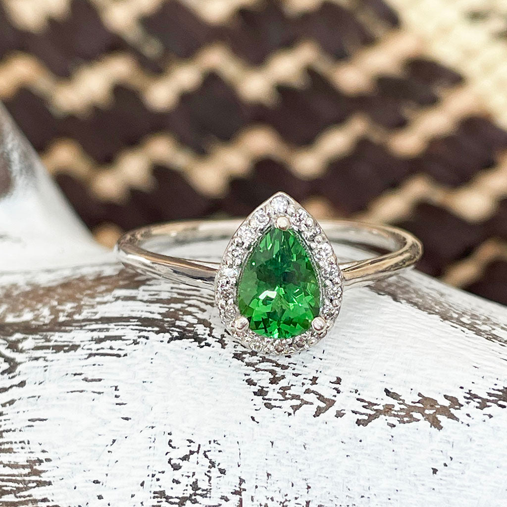 Tsavorite and diamond halo ring