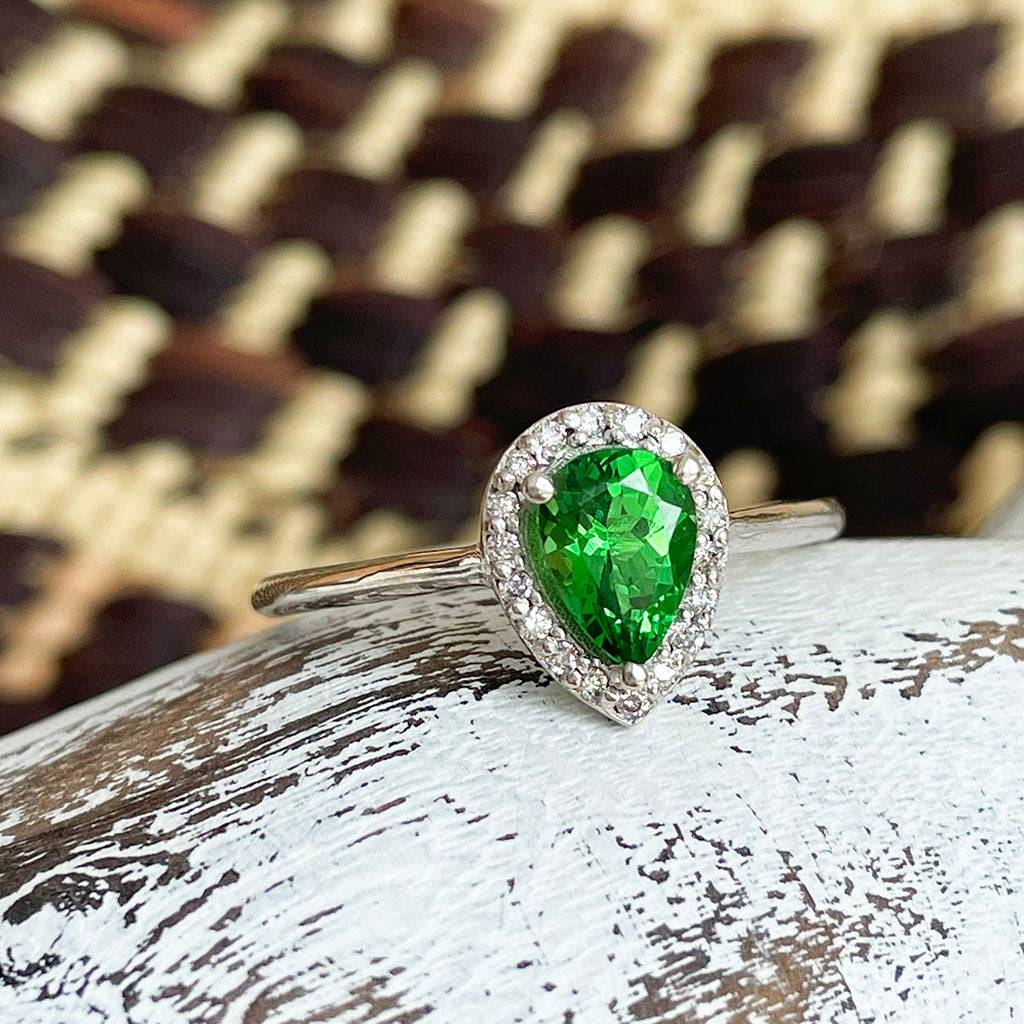 Tsavorite and diamond halo ring