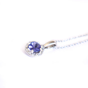 Elevated Tanzanite and Diamond Halo Pendant in White Gold
