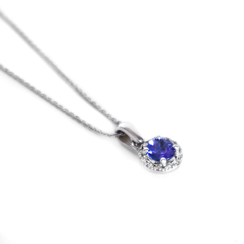 Elevated Tanzanite and Diamond Halo Pendant in White Gold
