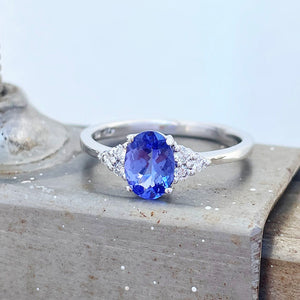 Oval Tanzanite and trilogy diamond ring