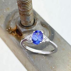 Oval Tanzanite and trilogy diamond ring