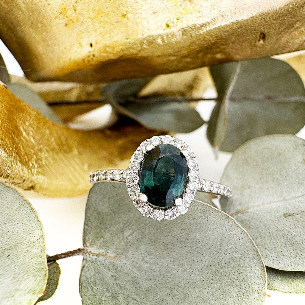 Green Hued Teal Sapphire and Diamond Halo White Gold Ring