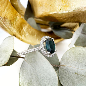 Green Hued Teal Sapphire and Diamond Halo White Gold Ring