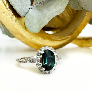 Green Hued Teal Sapphire and Diamond Halo White Gold Ring