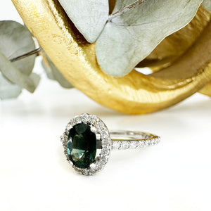 Green Hued Teal Sapphire and Diamond Halo White Gold Ring