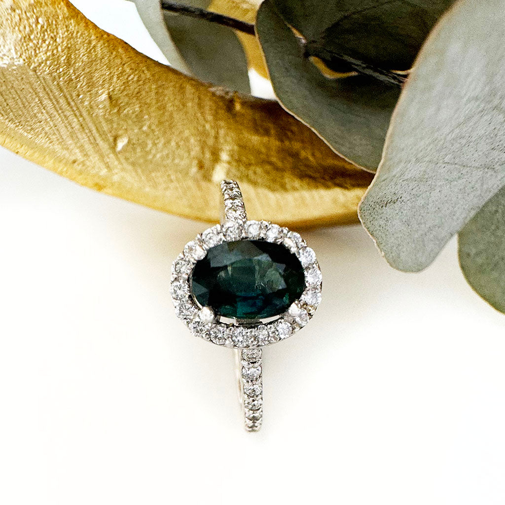 Green Hued Teal Sapphire and Diamond Halo White Gold Ring