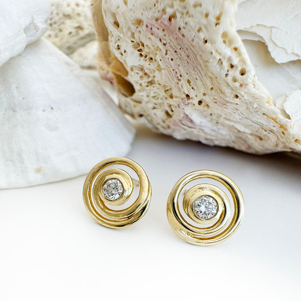 Flirty Infinity White Diamond Yellow Gold Swirl Studs