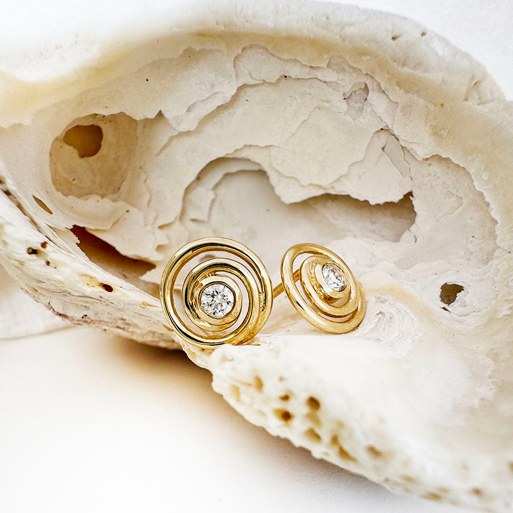 Flirty Infinity White Diamond Yellow Gold Swirl Studs