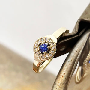 Tanzanite and Diamond Halo yellow gold ring
