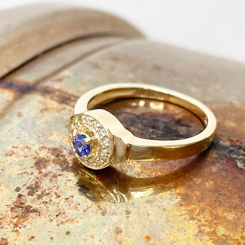 Tanzanite and Diamond Halo yellow gold ring