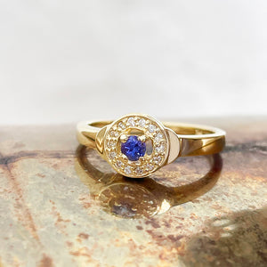 Tanzanite and Diamond Halo yellow gold ring