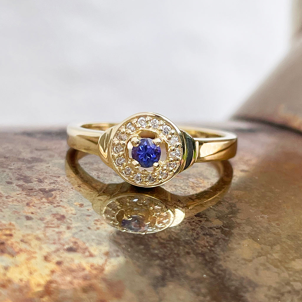 Tanzanite and Diamond Halo yellow gold ring