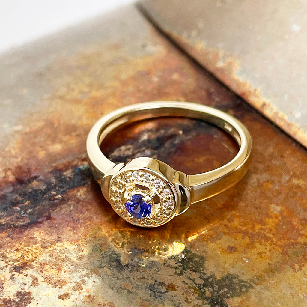 Tanzanite and Diamond Halo yellow gold ring