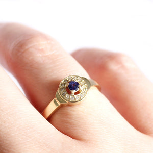 Regally Elevated Tanzanite Diamond Halo Yellow Gold Ring