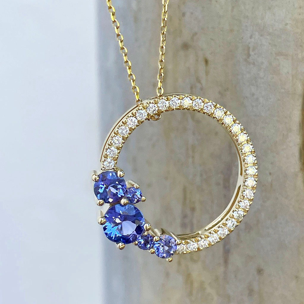 Tanzanite and diamond halo pendant