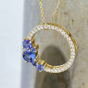 Tanzanite and diamond halo pendant