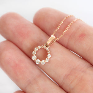 Subtle Crescendo Looped White Diamond Circular Rose Gold Pendant