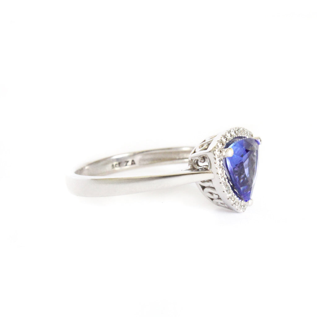 Tantalizing Trilliant Cut Tanzanite With Diamond Halo Ring