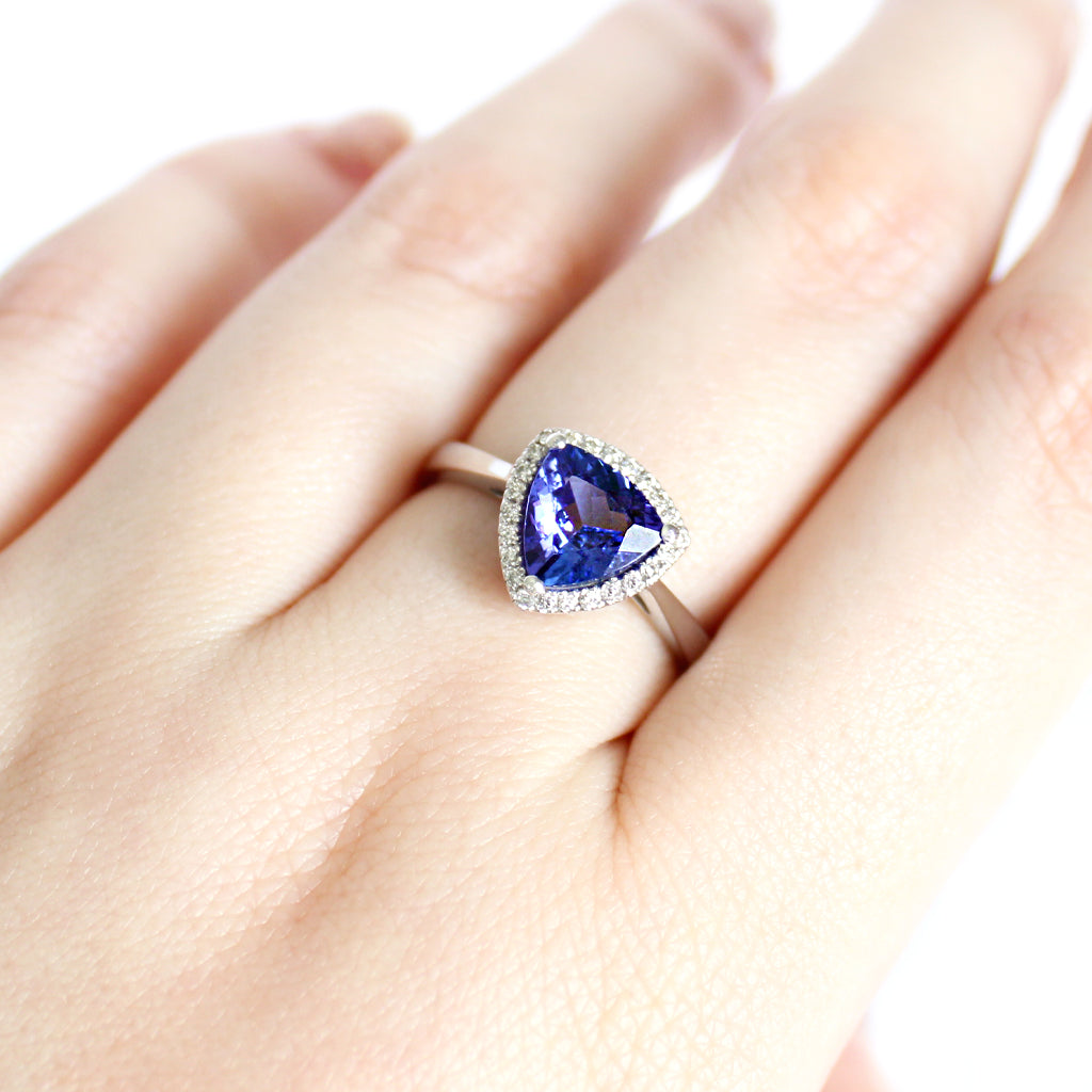 Tantalizing Trilliant Cut Tanzanite With Diamond Halo Ring