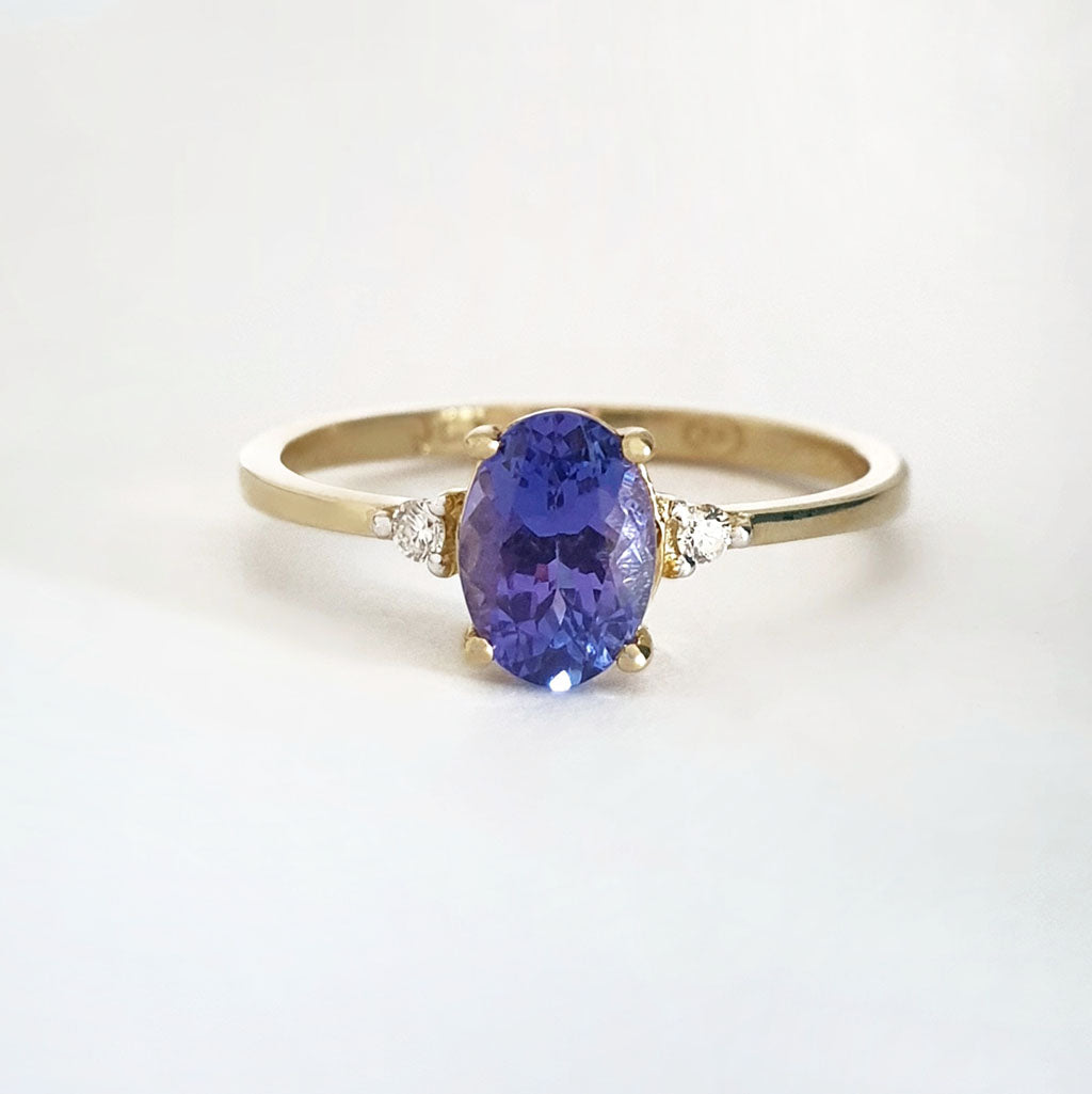 Elegant Oval Tanzanite and Petite Diamond Accent Yellow Gold Ring