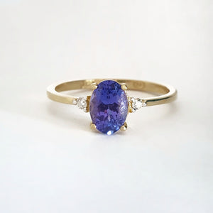 Elegant Oval Tanzanite and Petite Diamond Accent Yellow Gold Ring