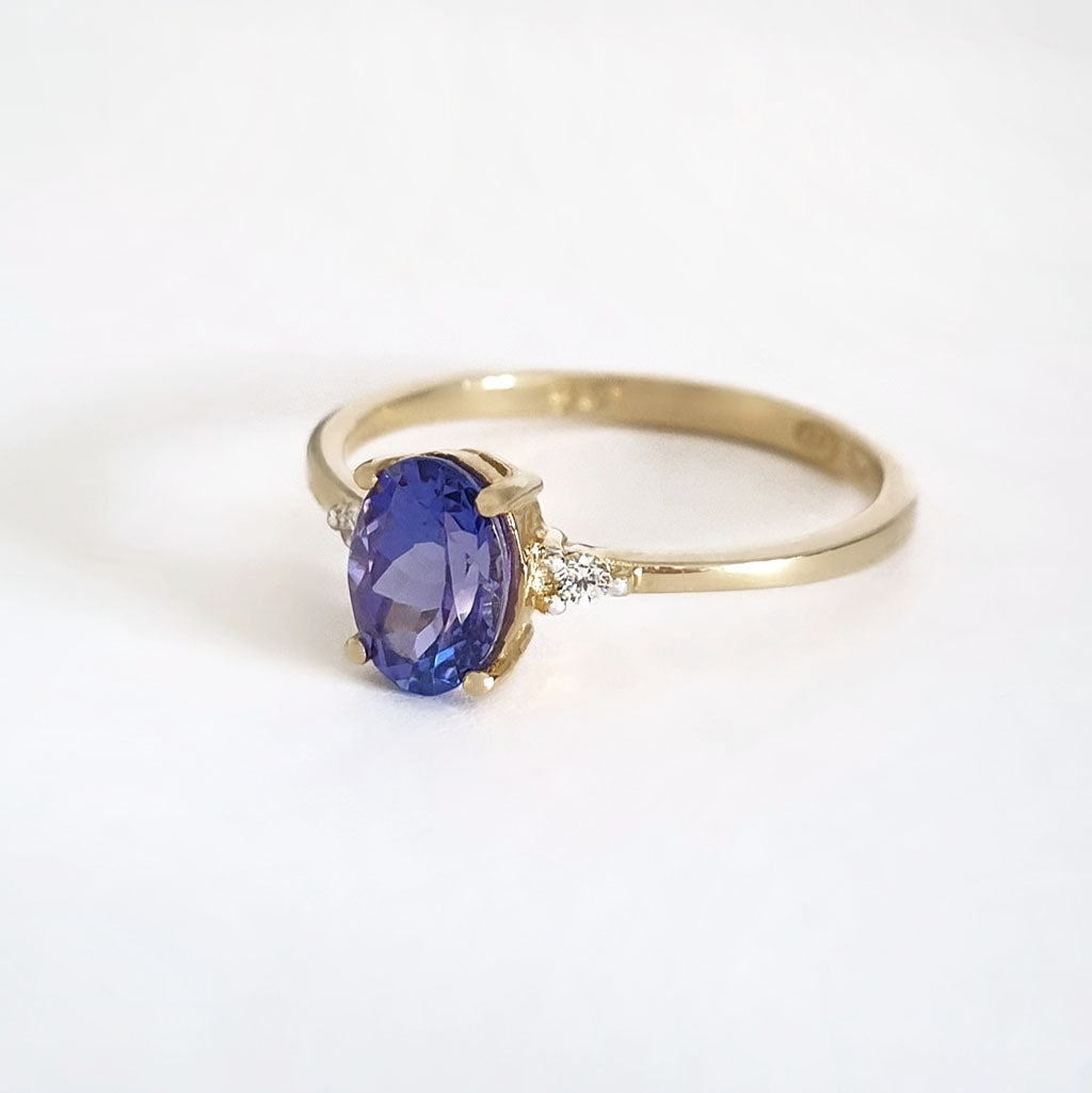 Elegant Oval Tanzanite and Petite Diamond Accent Yellow Gold Ring