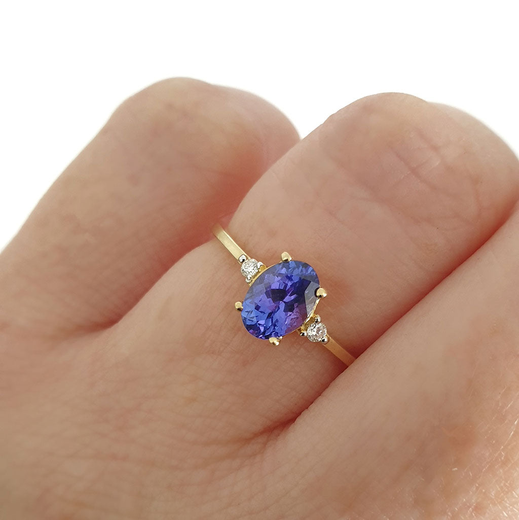 Elegant Oval Tanzanite and Petite Diamond Accent Yellow Gold Ring