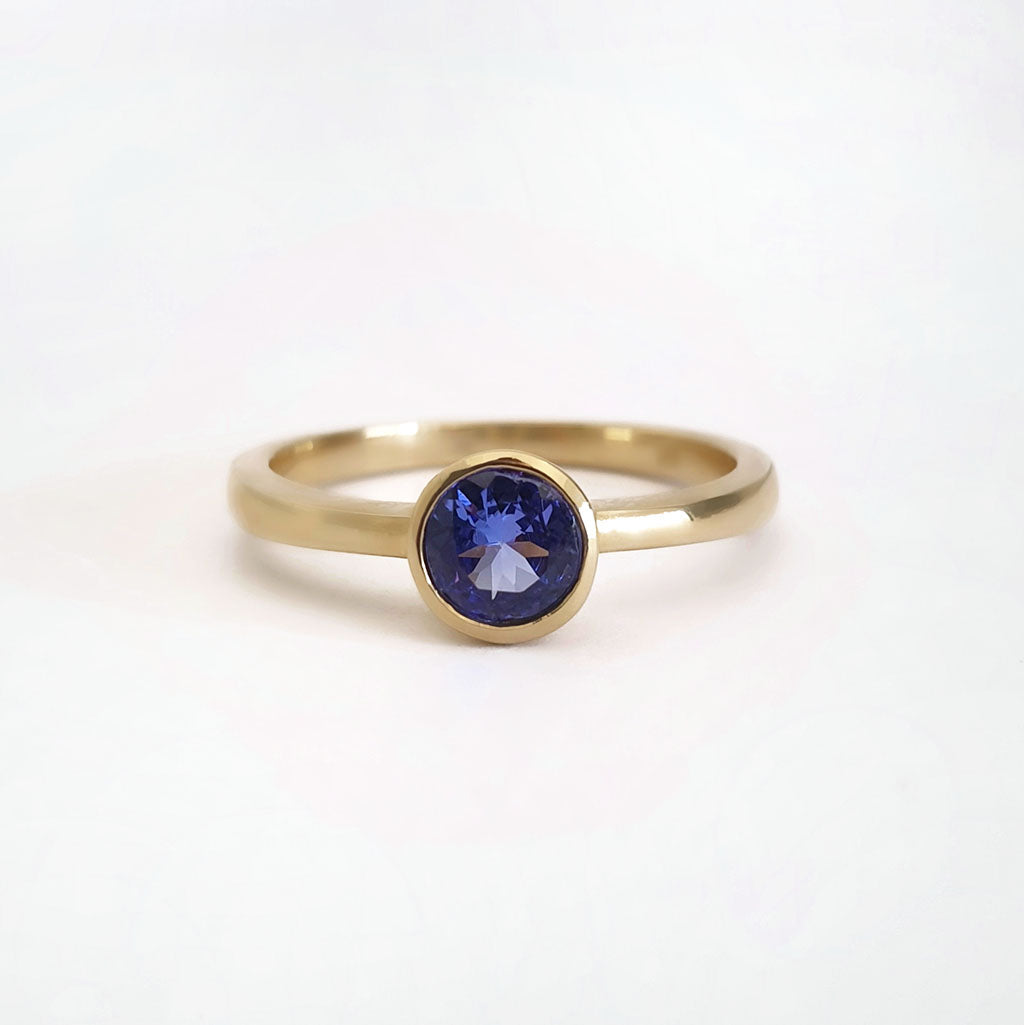 Elegant Round Cut Bezel Set Solitaire Tanzanite Ring