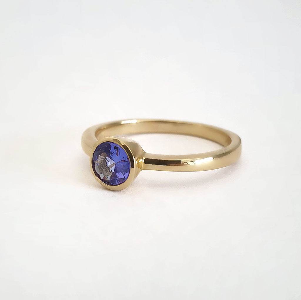 Elegant Round Cut Bezel Set Solitaire Tanzanite Ring