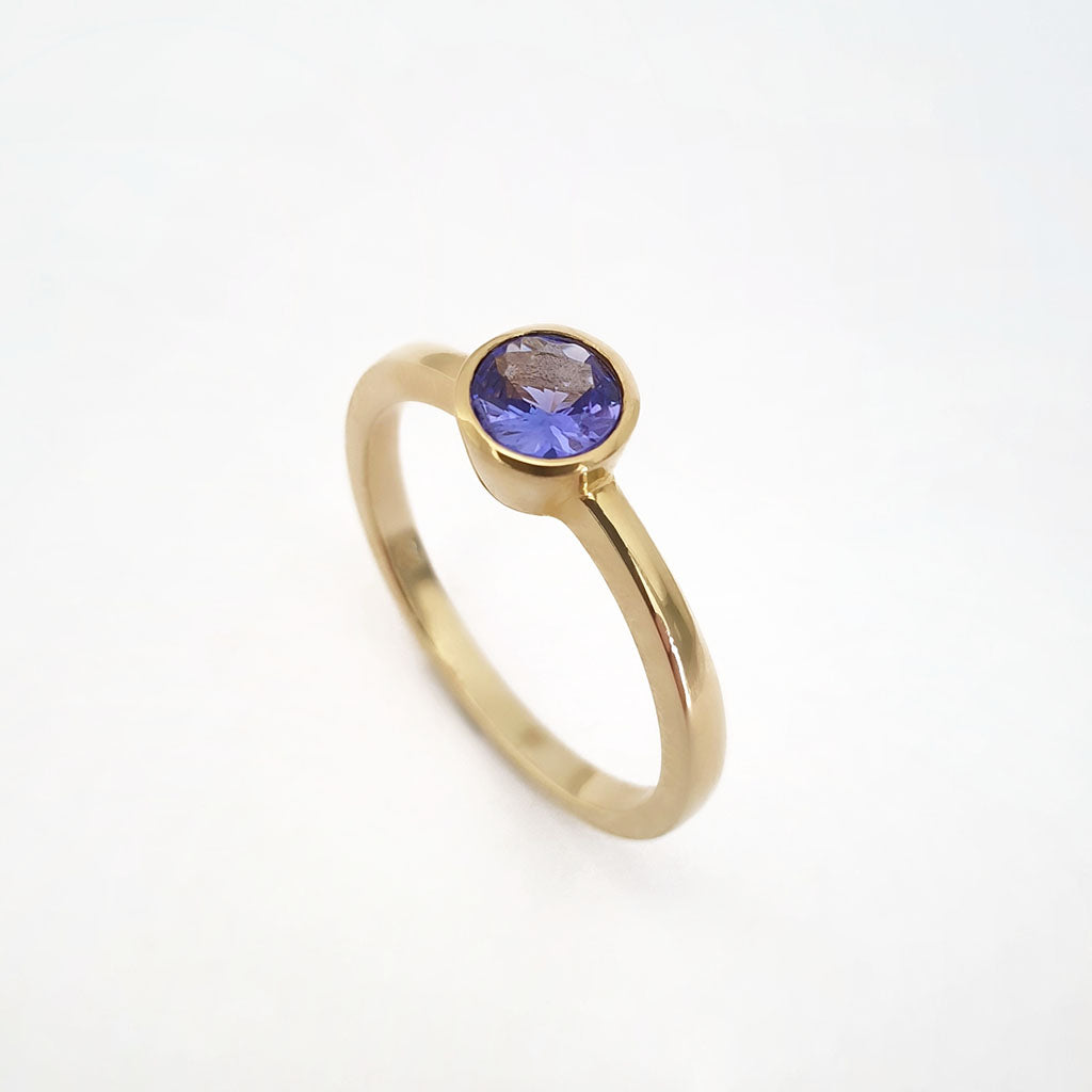 Elegant Round Cut Bezel Set Solitaire Tanzanite Ring