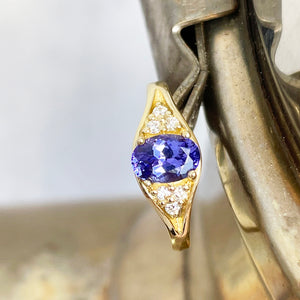 Regal Oval Tanzanite and Trilogy Diamond Shouldered Yellow Gold Ring