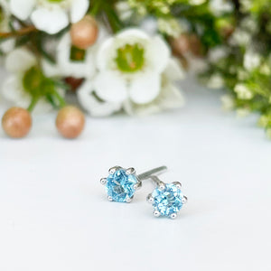 Silver Petite 6 Claw Blue Topaz Studs