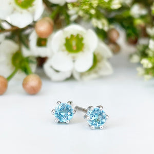 Silver Petite 6 Claw Blue Topaz Studs