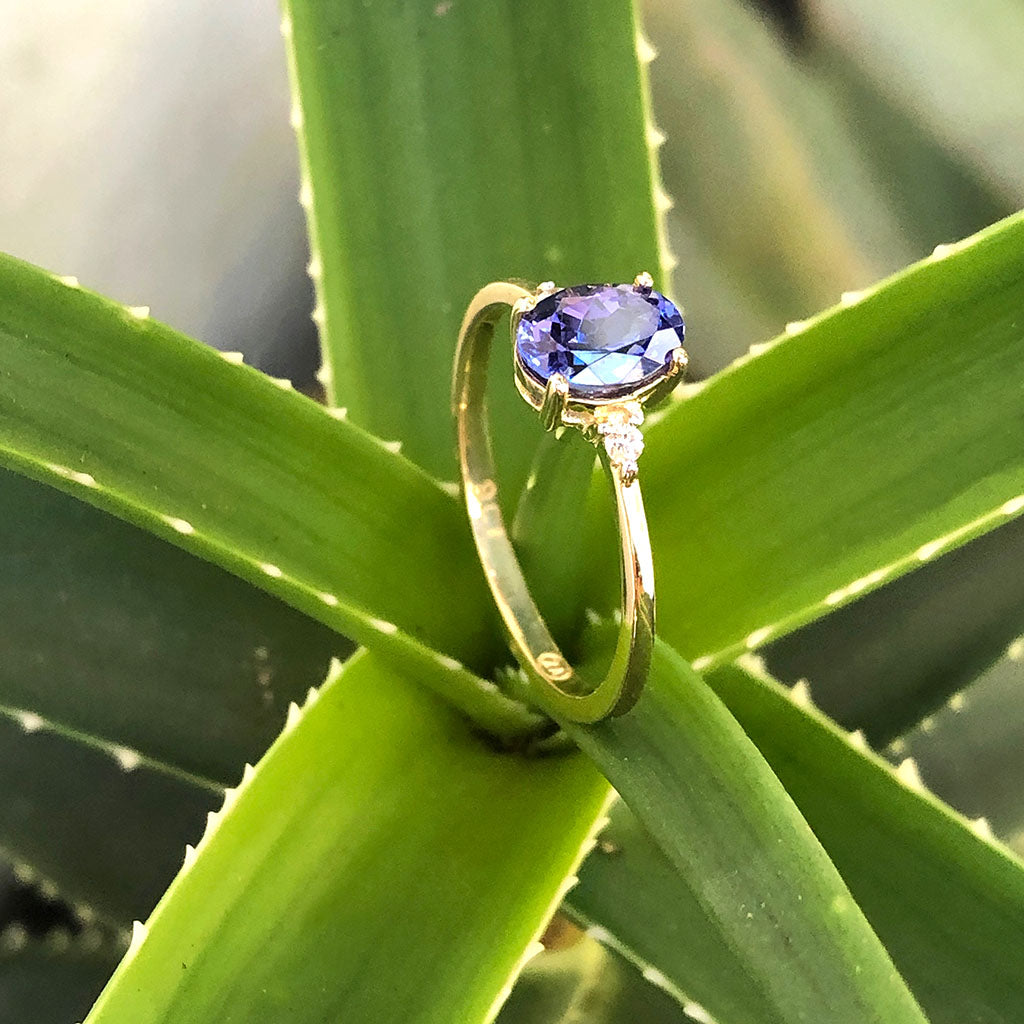 Elegant Oval Tanzanite and Petite Diamond Accent Yellow Gold Ring