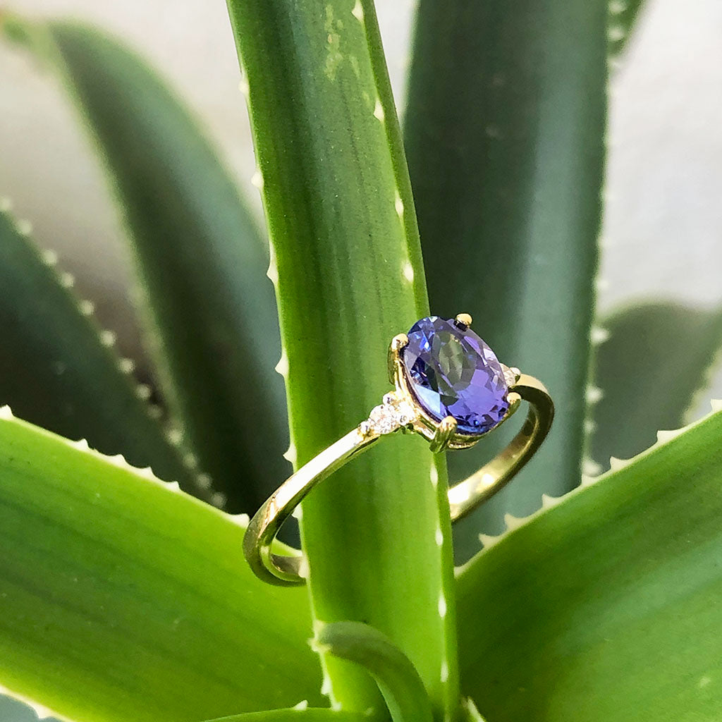 Elegant Oval Tanzanite and Petite Diamond Accent Yellow Gold Ring